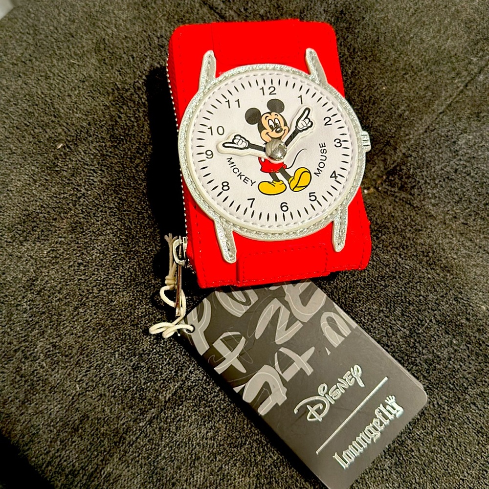 Mickey Mouse wallet matches backpack.